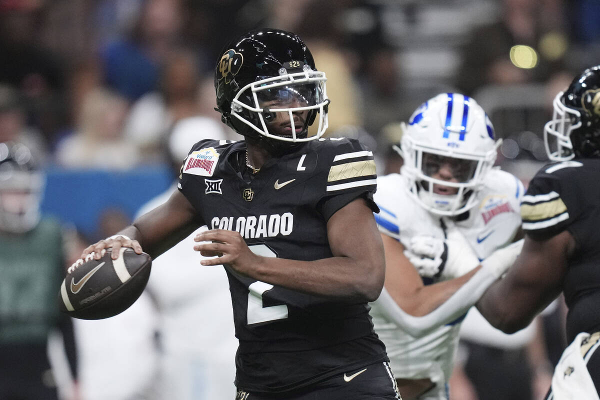 Colorado quarterback Shedeur Sanders (2) looks to throw against BYU during the first half of th ...