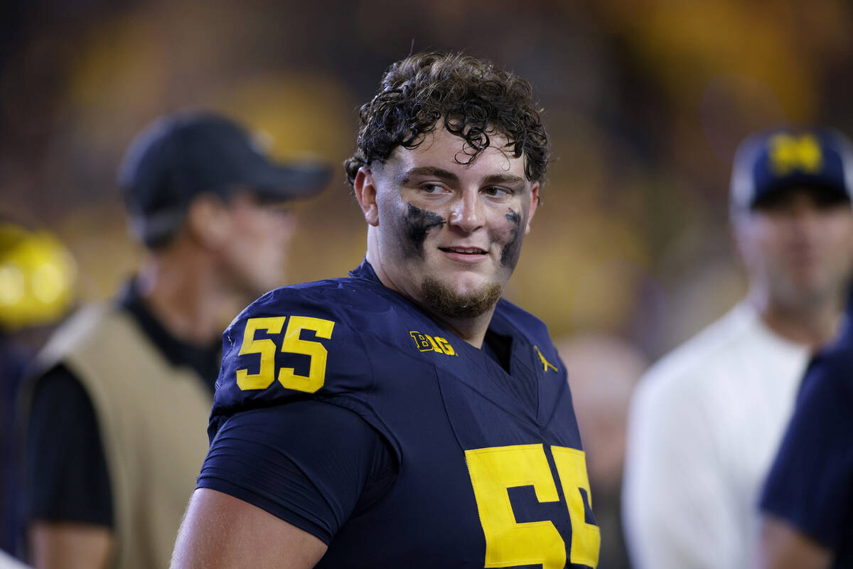 Michigan defensive lineman Mason Graham (55) walks off the field following an NCAA football gam ...