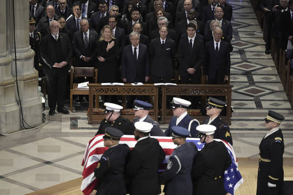 The flag-draped casket of former President Jimmy Carter departs after a state funeral at Washin ...