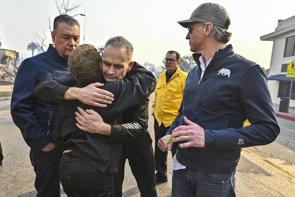 Los Angeles City Fire Captain Frank Lima, greets Los Angeles Mayor Karen Bass, as she joins Cal ...