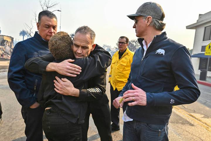 Los Angeles City Fire Captain Frank Lima, greets Los Angeles Mayor Karen Bass, as she joins Cal ...