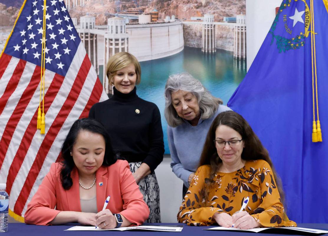 U.S. Rep. Susie Lee, left, and U.S. Rep. Dina Titus watch as Bureau of Reclamation Commissioner ...