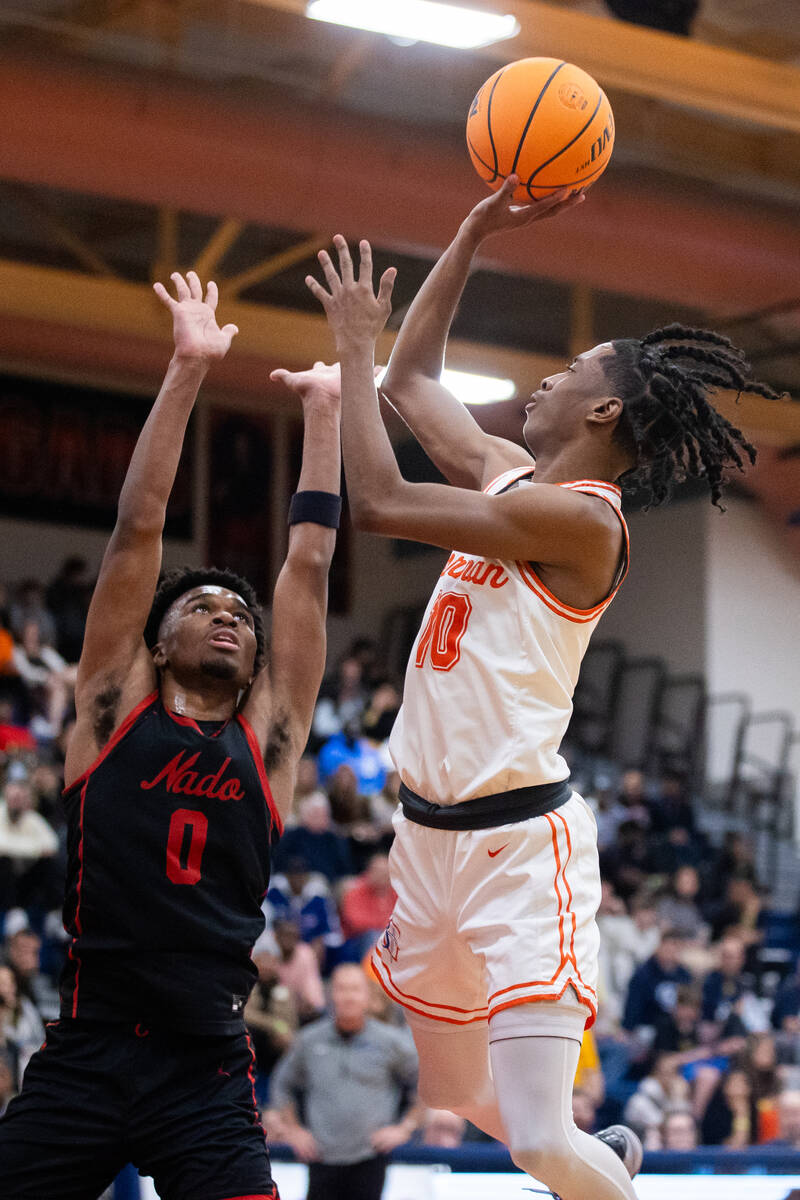 Coronado’s Jonny Collins (0) jumps up to block Bishop Gorman’s Nick Jefferson (10 ...