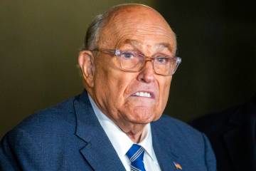 FILE - Rudy Giuliani speaks to the media outside Manhattan federal court in New York after test ...