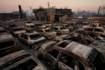 Cars are left charred inside a dealership in the aftermath of the Eaton Fire Friday, Jan. 10, 2 ...