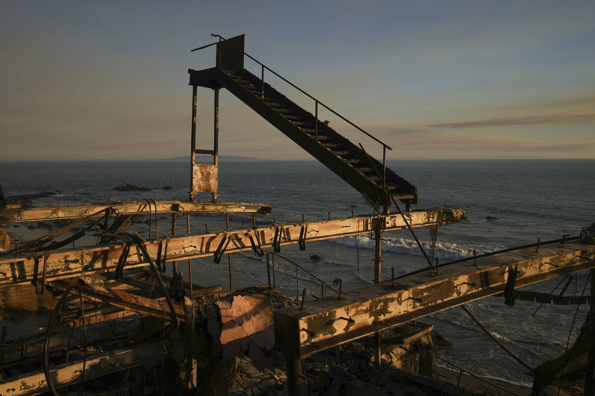 A burnt staircase stands on a building destroyed by the Palisades Fire in Malibu, Calif., Frida ...