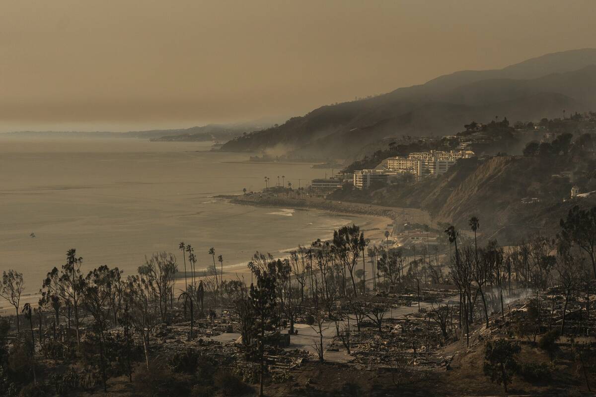 A mobile home community devastated by the Palisades Fire is visible at bottom in the Pacific Pa ...