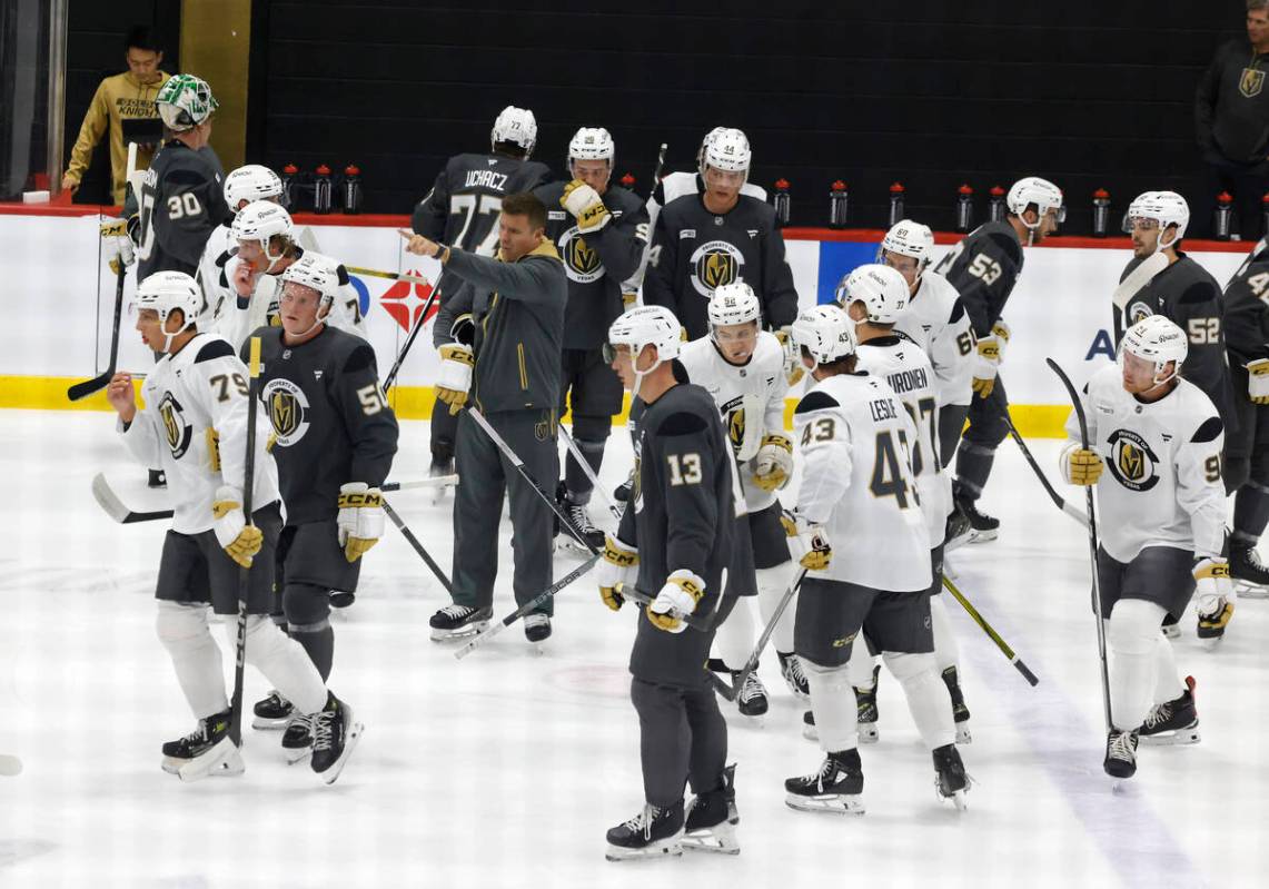 Henderson Silver Knights head coach Ryan Craig, center, directs players during first day of Gol ...