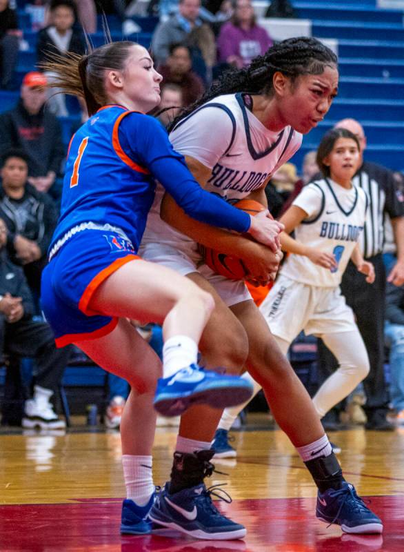 Bishop Gorman guard Baylee Holton (1)reaches around to grab the ball against Centennial guard A ...