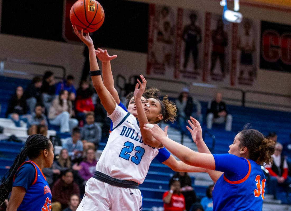 Centennial forward Damoni Poole (23) lays in the ball past Bishop Gorman guard Aaliah Spaight ( ...