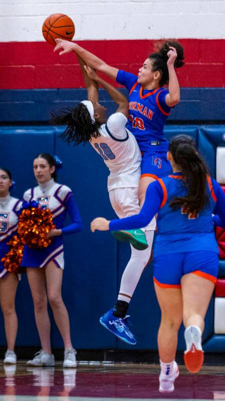 Centennial guard Sanai Branch (10) has a shot blocked by Bishop Gorman guard Aaliah Spaight (10 ...