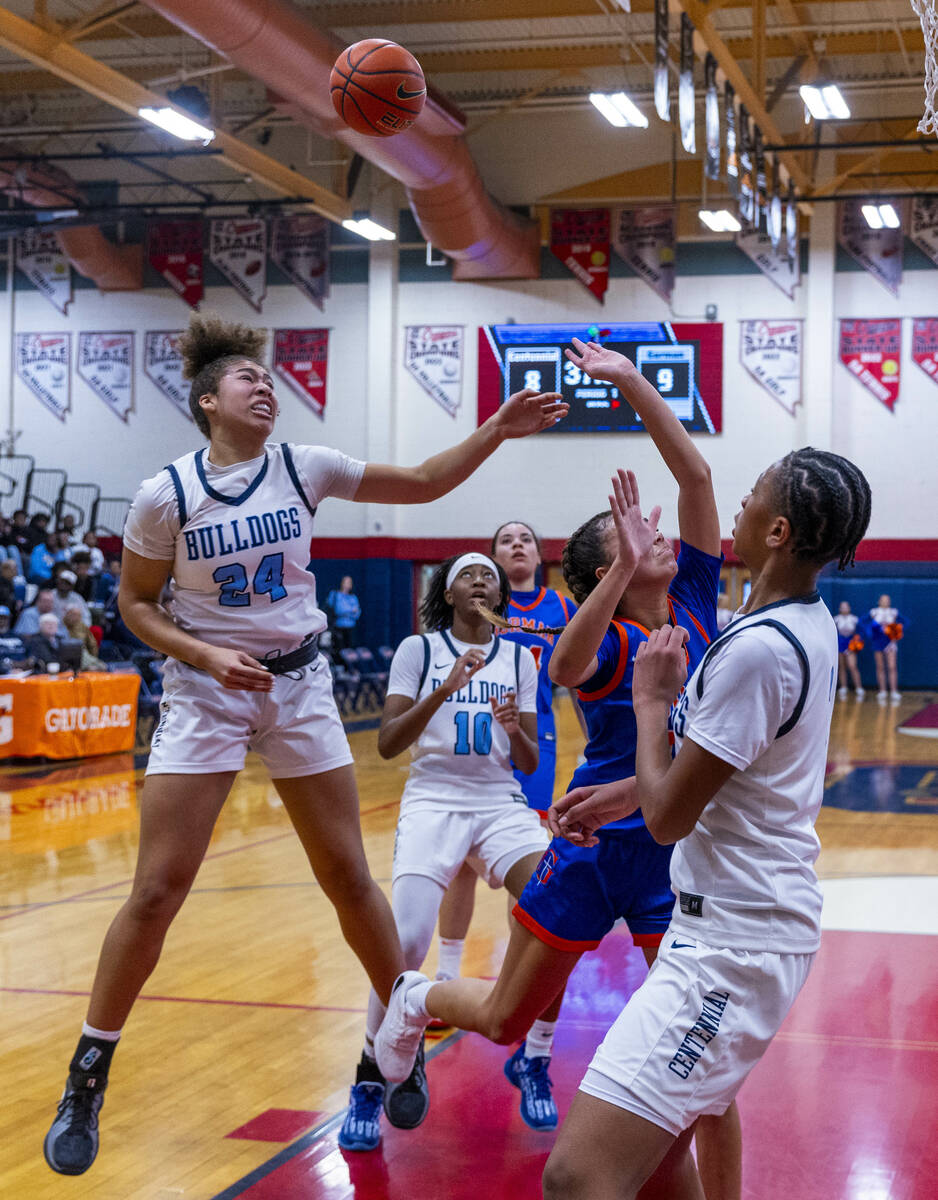 Centennial forward Nation Williams (24) battles for a rebound with Bishop Gorman guard Addysen ...