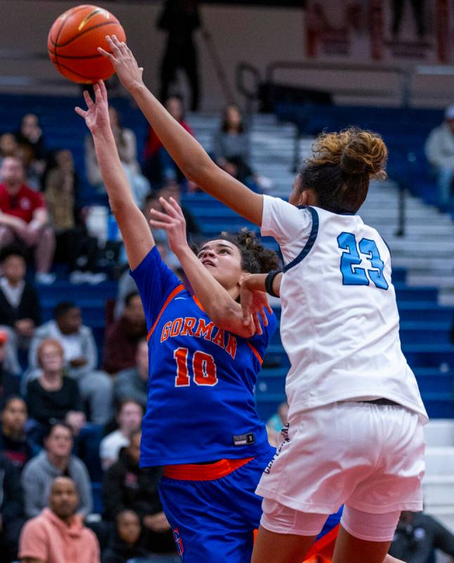 Bishop Gorman's guard Aaliah Spaight (10) has a shot blocked by Centennial forward Damoni Poole ...