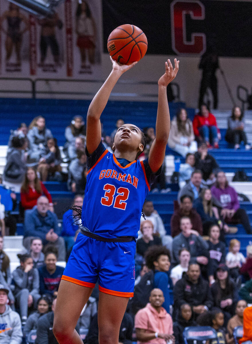 Bishop Gorman center Aubrey Johnson (32) lays up the ball against Centennial during the first h ...