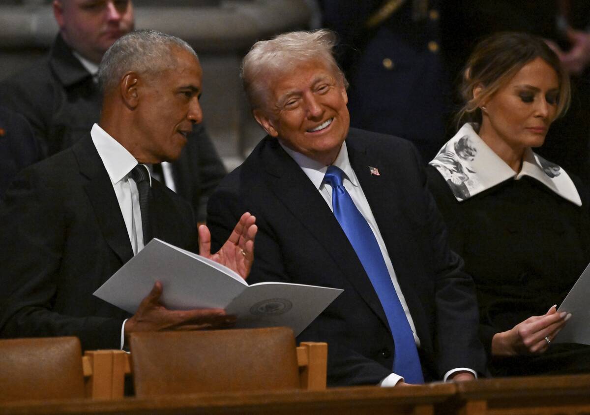 Former President Barack Obama, from left, speaks with President-elect Donald Trump as his wife ...