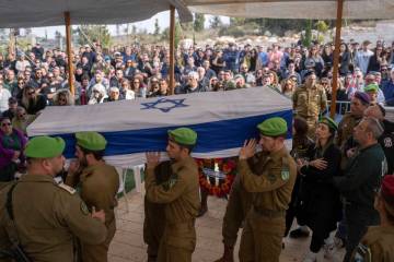 Israeli soldiers and relatives carry the flag-draped casket of Sergeant Yahav Maayan, who was k ...