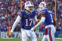 Buffalo Bills quarterback Josh Allen (17) celebrates with wide receiver Curtis Samuel (1) after ...