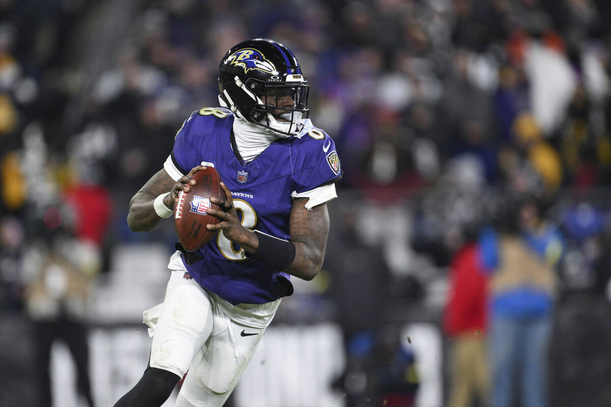 Baltimore Ravens quarterback Lamar Jackson (8) looks to pass the ball during the second half of ...