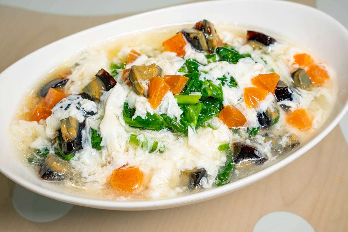 Pea sprouts in supreme broth with salted and century eggs for Lunar New Year 2025 from Beijing ...