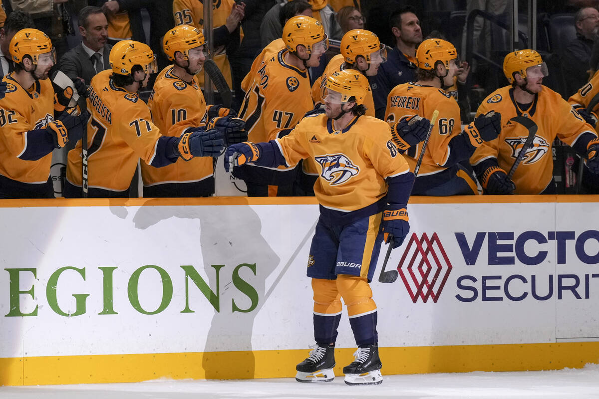 Nashville Predators center Jonathan Marchessault (81) celebrates his goal with teammates during ...