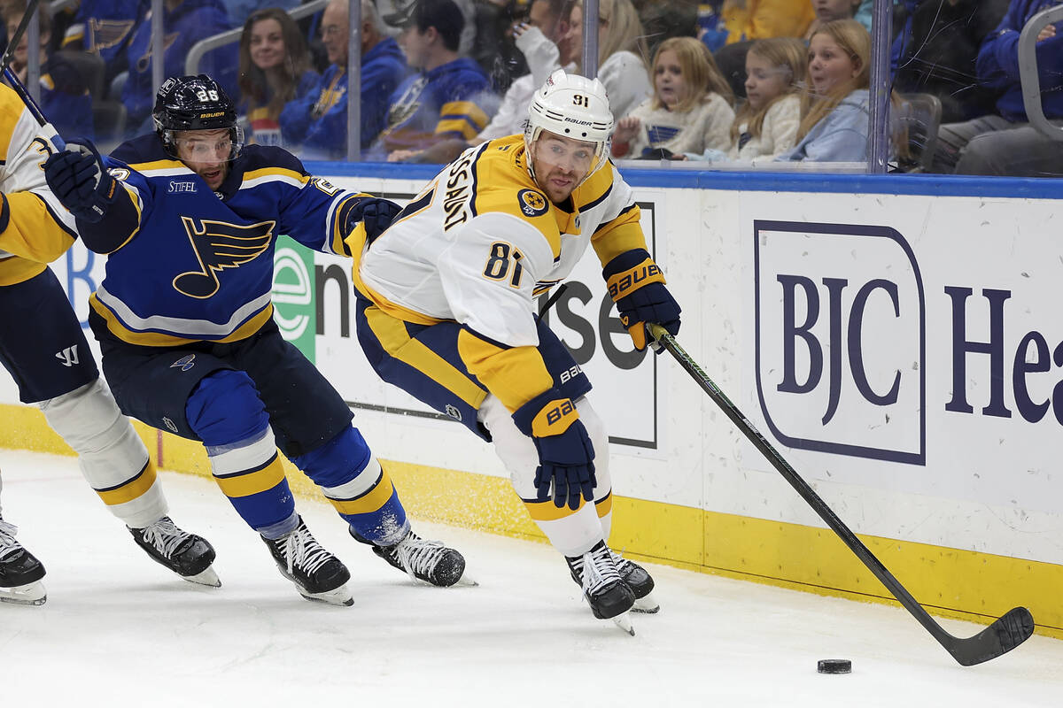 Nashville Predators' Jonathan Marchessault (81) vies for control of the puck while under pressu ...