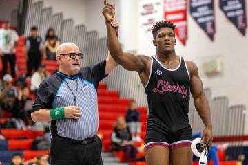 Liberty’s Melvin Whitehead has his hand raised after defeating SLAM Academy’s Sat ...