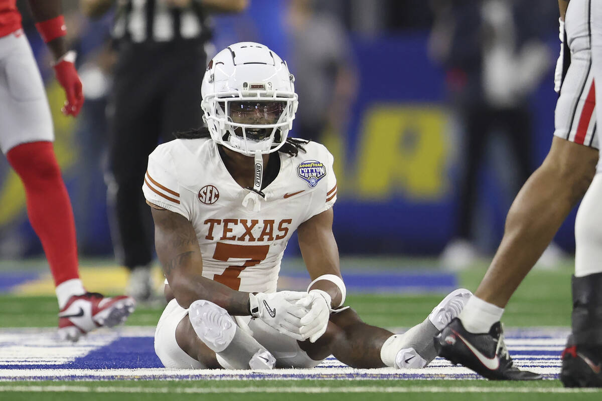 Texas wide receiver Isaiah Bond (7) reacts after an incomplete pass during the first half of th ...