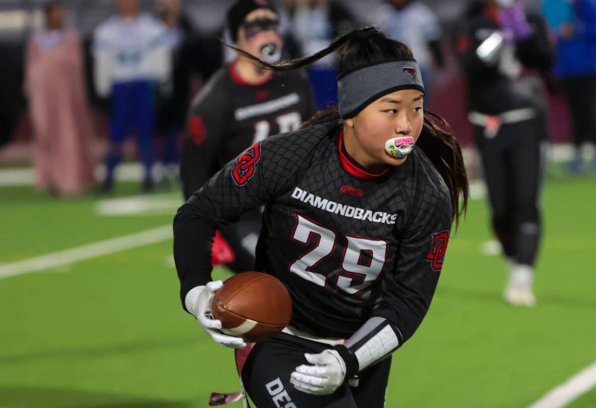 Desert Oasis' Akiko Higa (29) runs the ball against Green Valley during a flag football game at ...