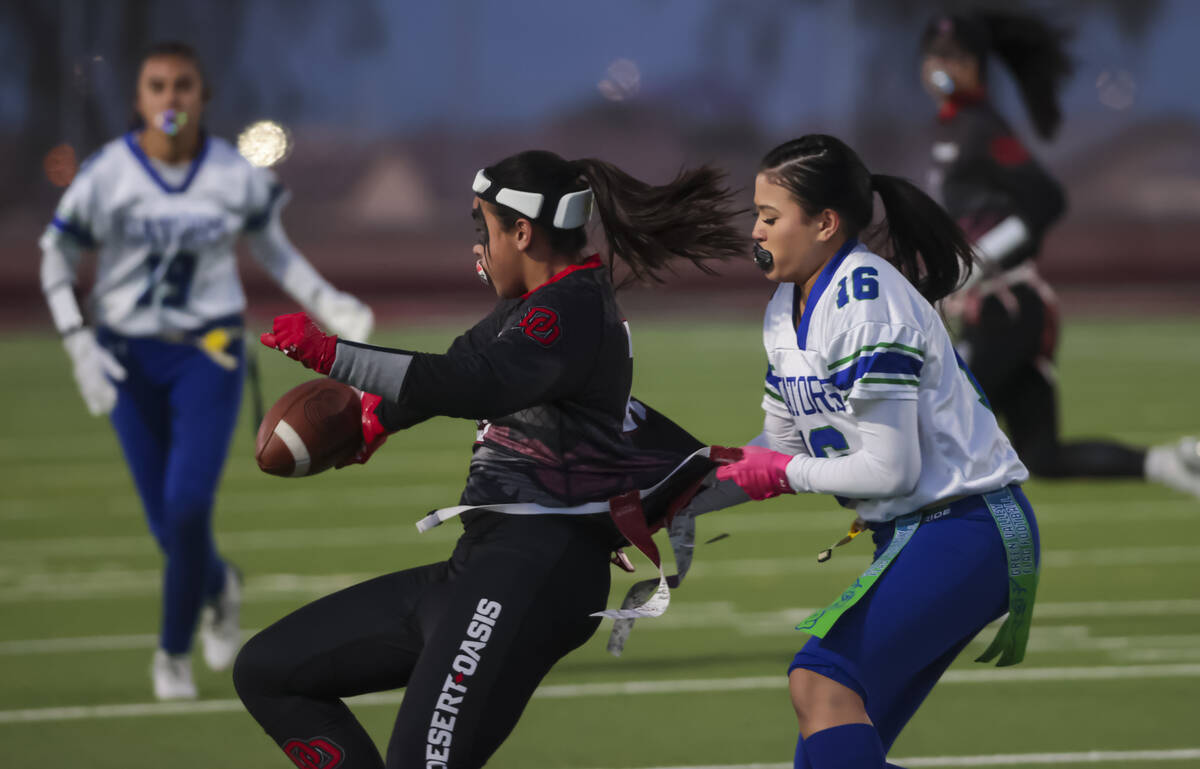 Desert Oasis' Chelsea DeWitt (21) gets tagged out by Green Valley's Camille Tafua (16) during a ...