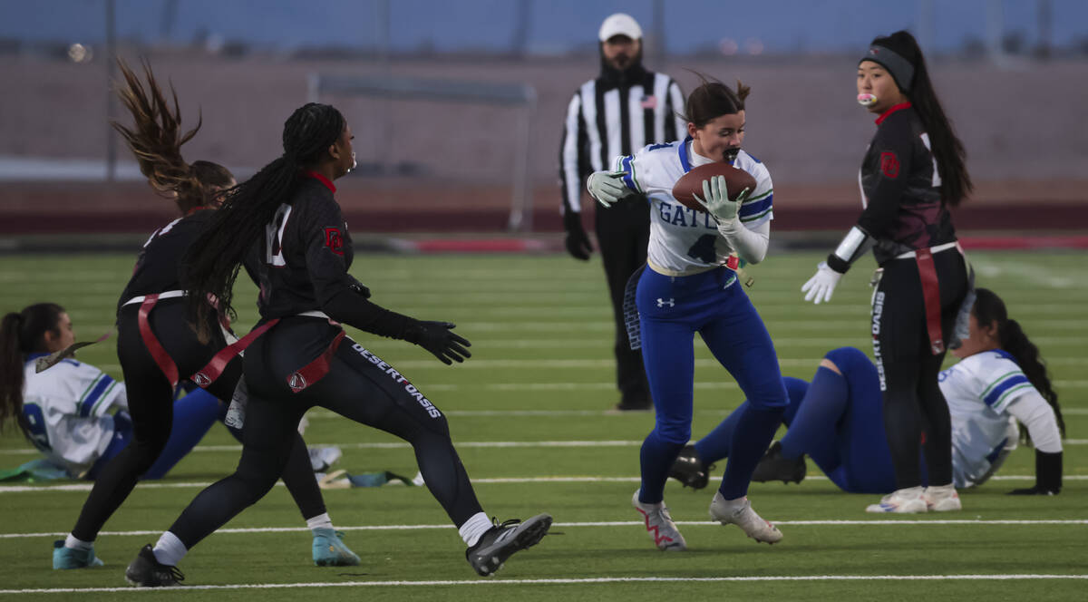 Green Valley's Lauryn Galvin (4) pulls in a pass during a flag football game at Desert Oasis Hi ...