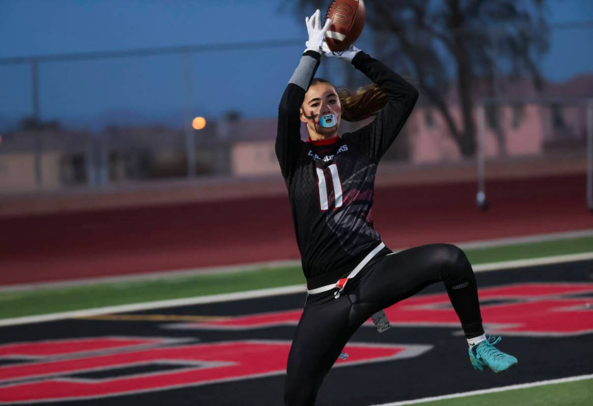 Desert Oasis' Aniyah I'i (11) catches a touchdown pass during a flag football game against Gree ...