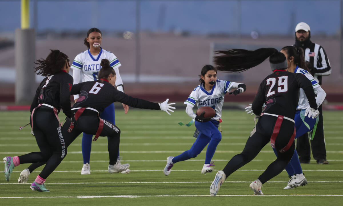 Green Valley’s Aundrea Velez (5) runs the ball during a flag football game at Desert Oas ...