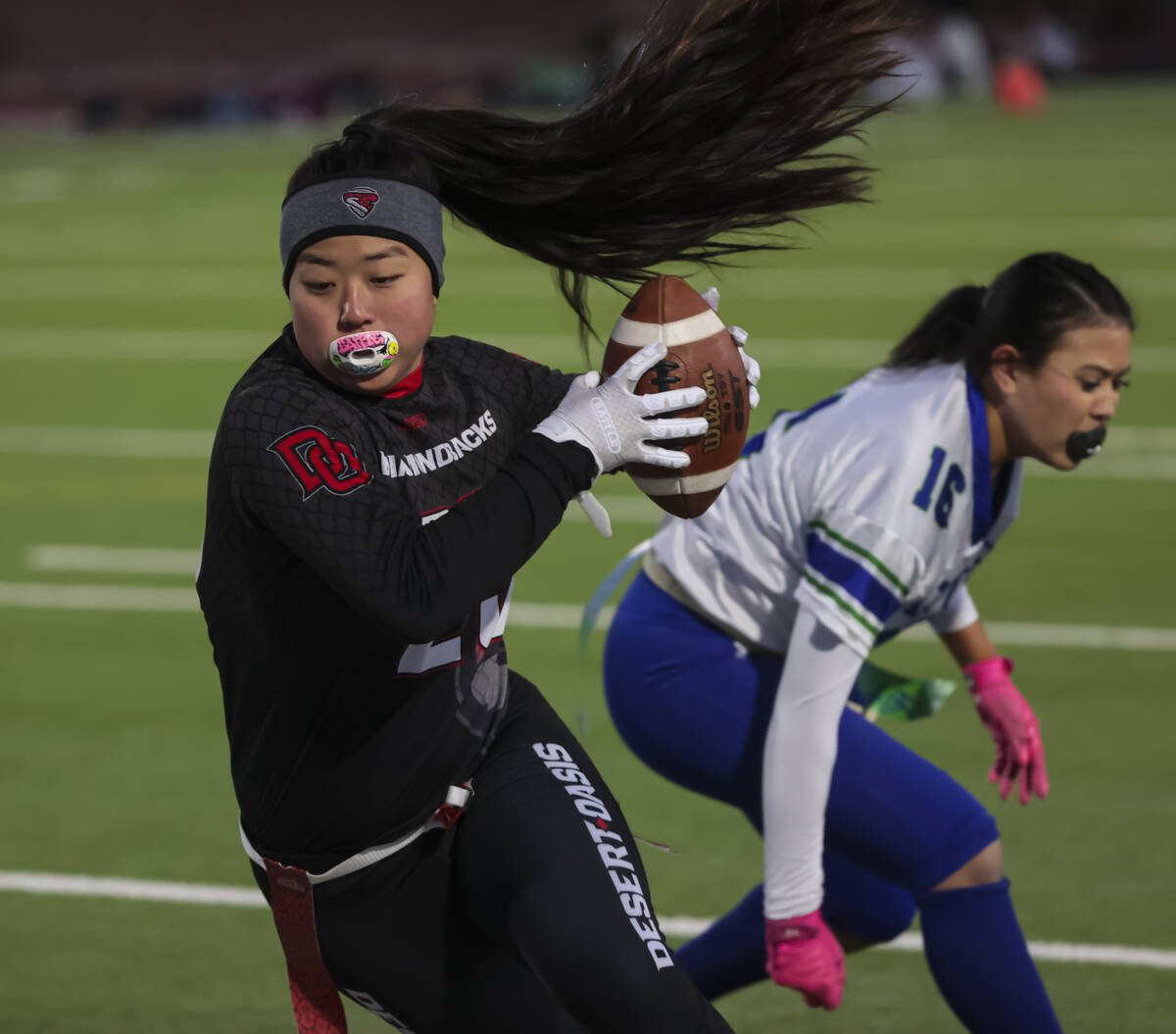 Desert Oasis' Akiko Higa (29) runs the ball against Green Valley during a flag football game at ...