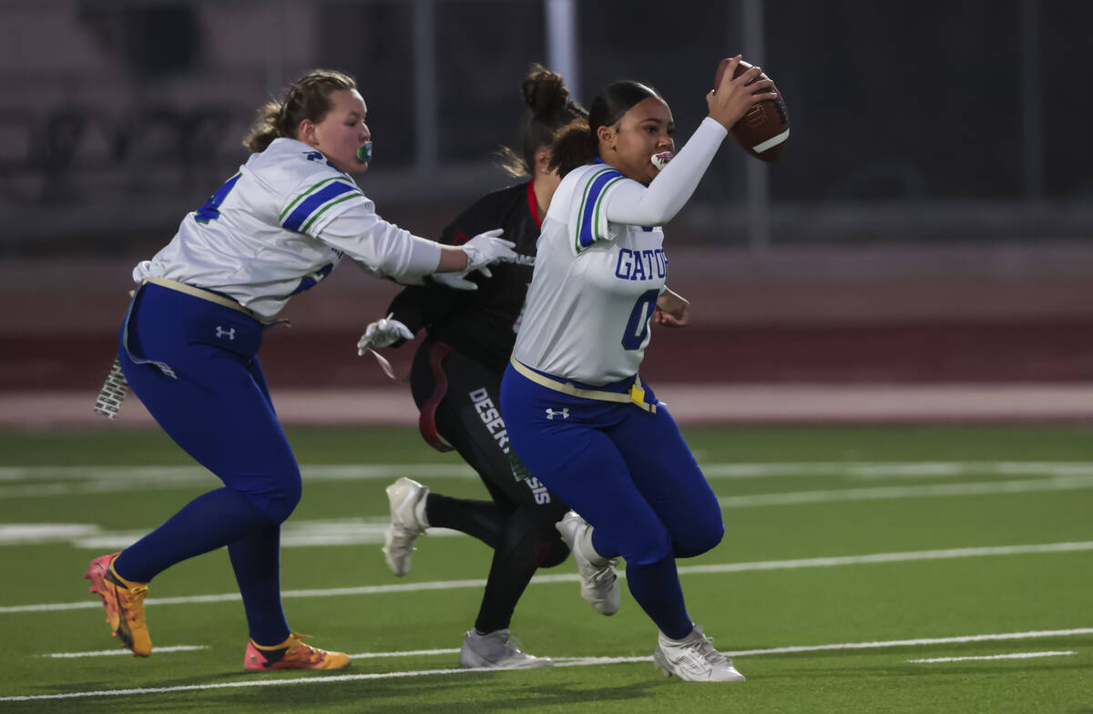 Green Valley quarterback Janae Peebles (0) runs the ball during a flag football game at Desert ...