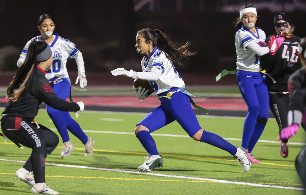 Green Valley's Jordyn Terry (19) runs the ball during a flag football game at Desert Oasis High ...