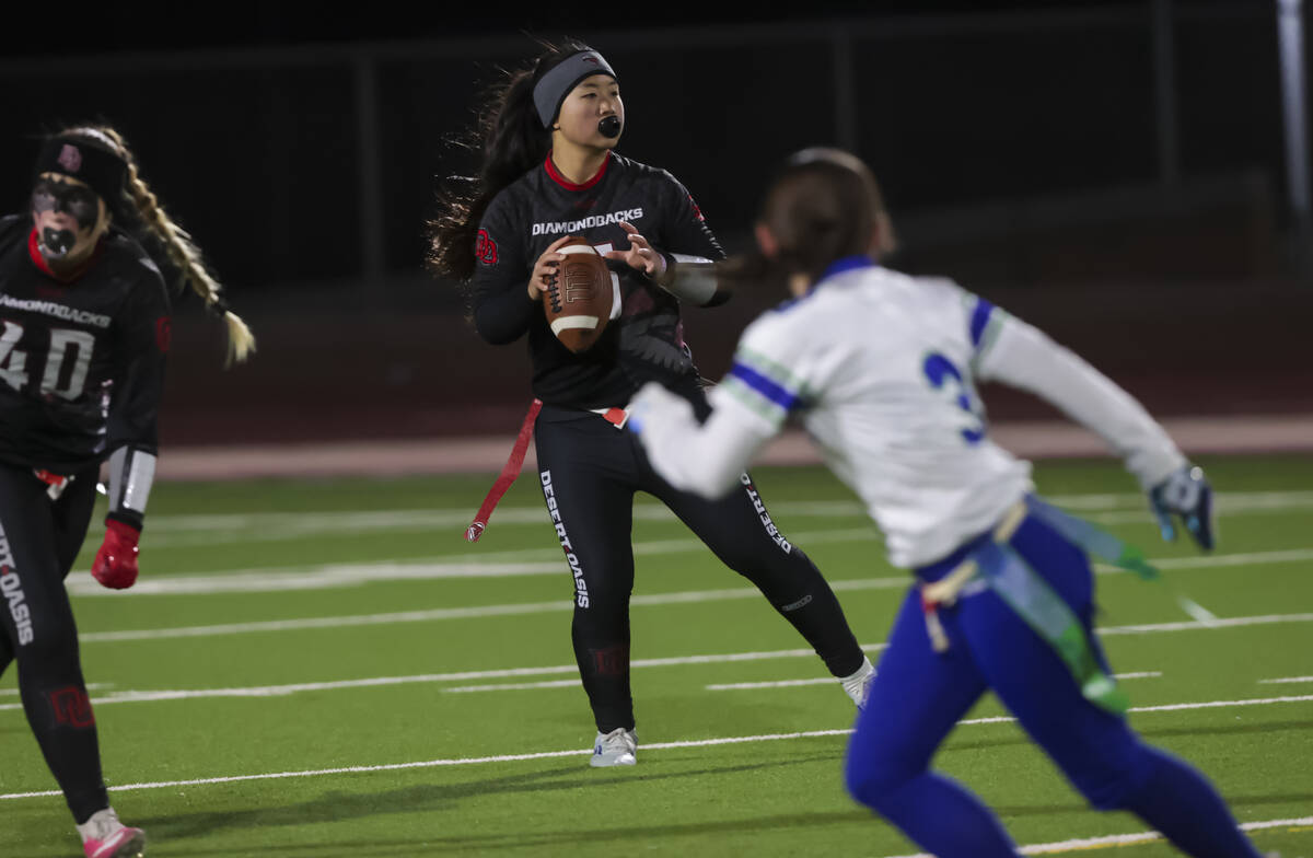 Desert Oasis' Akemi Higa (5) looks to throw a pass during a flag football game against Green Va ...