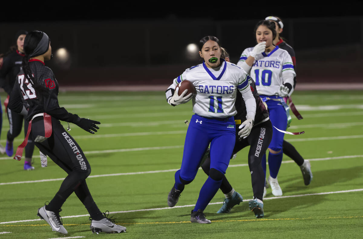 Green Valley's Kayana Fejerang (11) runs the ball during a flag football game at Desert Oasis H ...