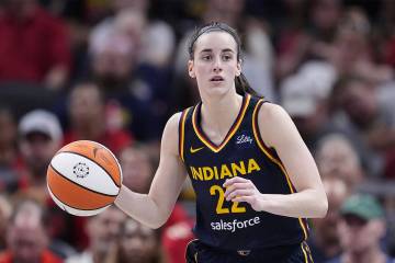 FILE - Indiana Fever guard Caitlin Clark (22) plays against the Dallas Wings in the second half ...