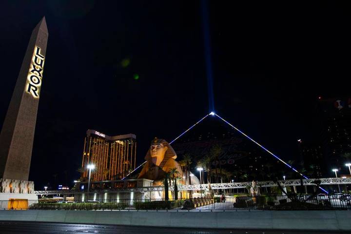 The Luxor illuminates with yellow and blue colors in support of Ukraine on Sunday, March 6, 202 ...