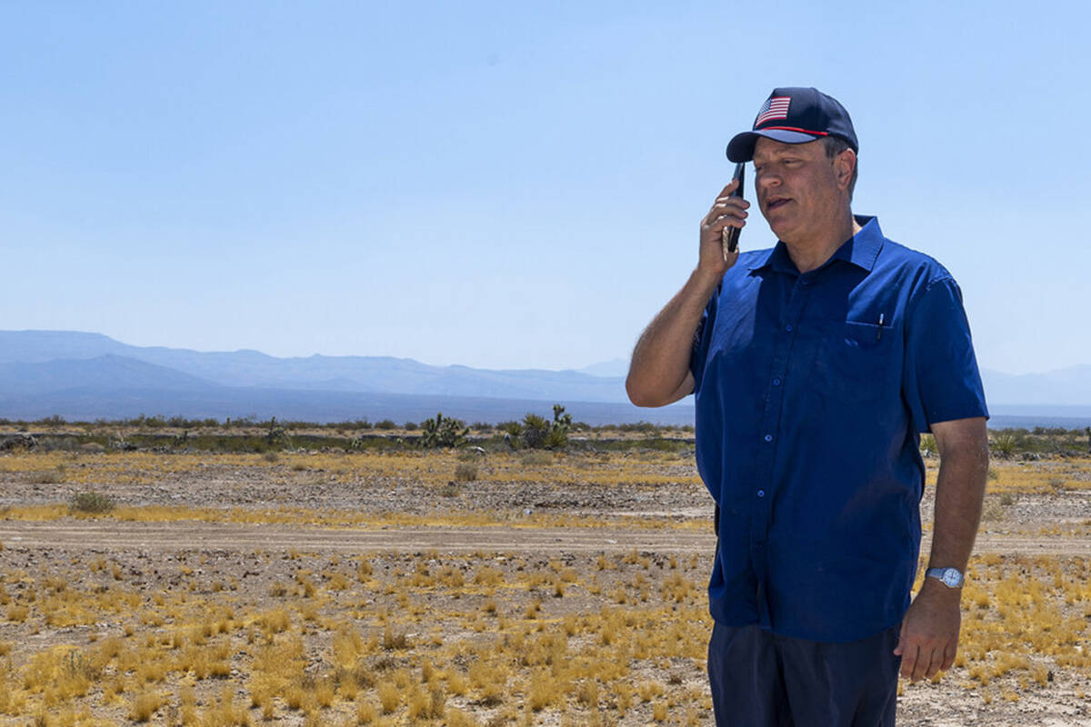 Spaceport CEO Rob Lauer makes a call while out on the empty land he plans to build on outside o ...