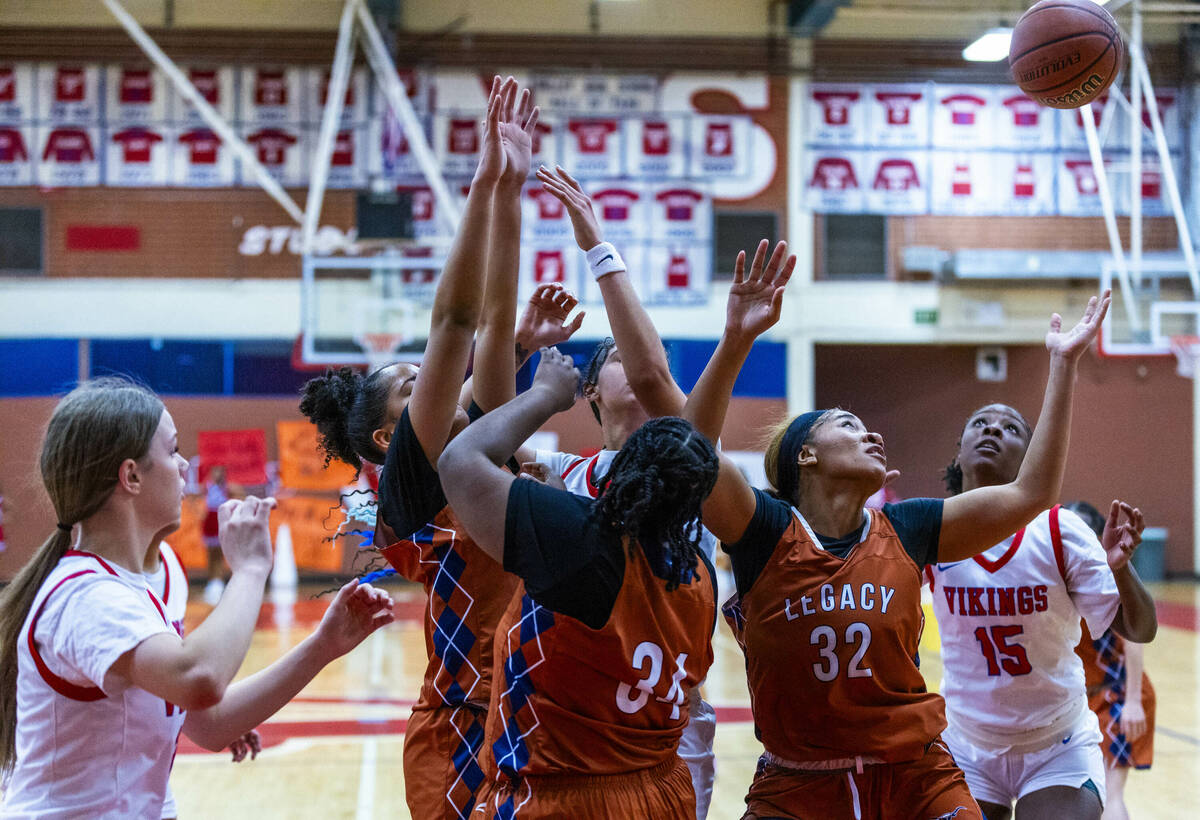 Legacy's Ajalee Williams (32) looks to grab a rebound against Valley's Laneice Rodgers (15) dur ...