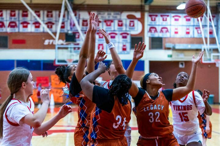 Legacy's Ajalee Williams (32) looks to grab a rebound against Valley's Laneice Rodgers (15) dur ...