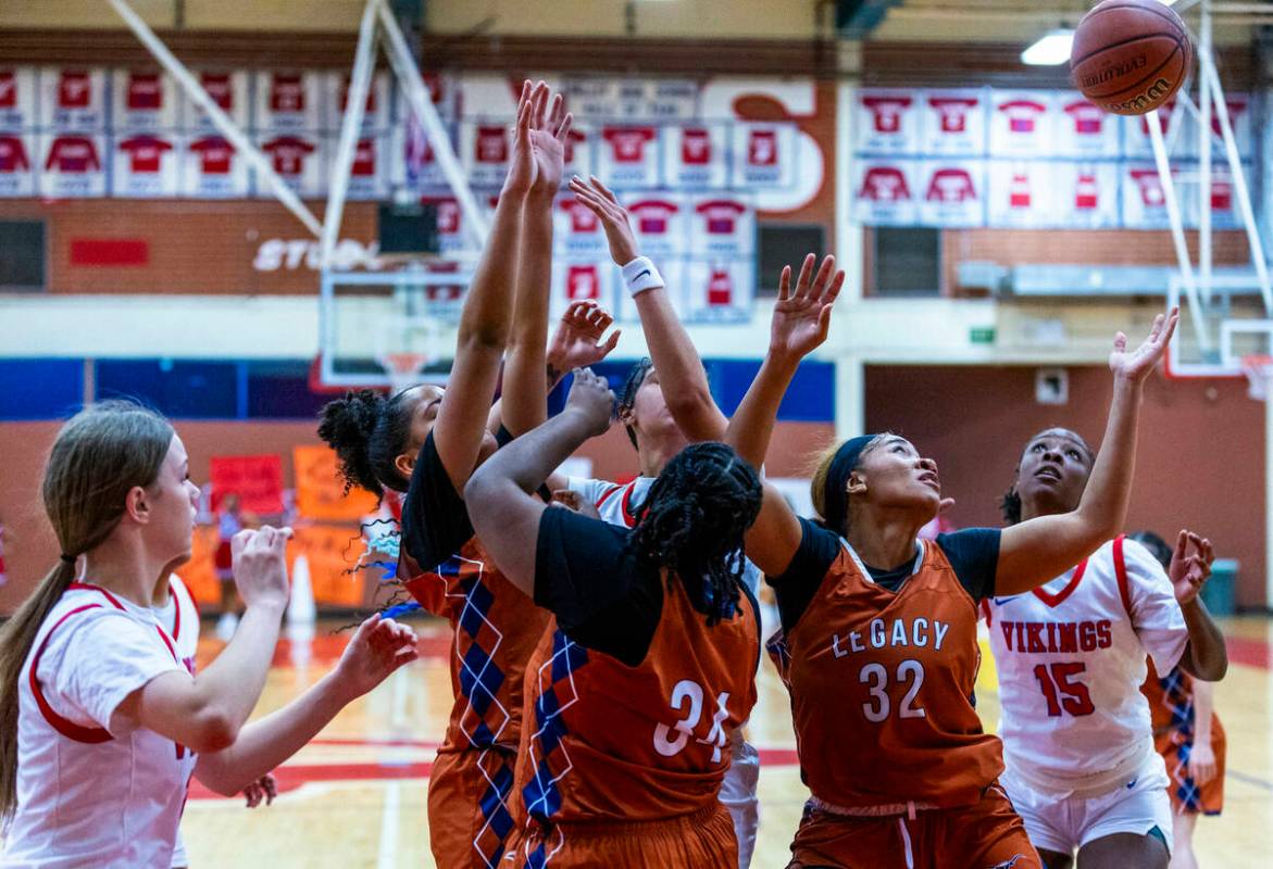 Legacy's Ajalee Williams (32) looks to grab a rebound against Valley's Laneice Rodgers (15) dur ...