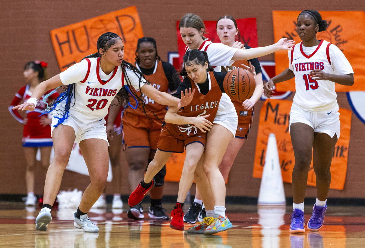 Legacy's Shalena Mesiona (2) battles to get up the court with tough defense by Valley's Jennife ...