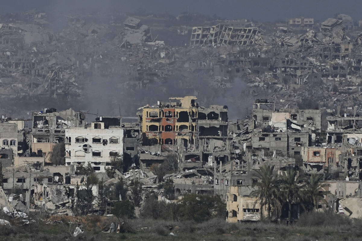 Destroyed buildings by Israeli bombardments are seen inside the Gaza Strip from southern Israel ...