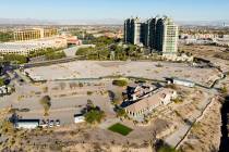 An aerial view of the shuttered Badlands Golf Course clubhouse, front, the Queensridge towers, ...