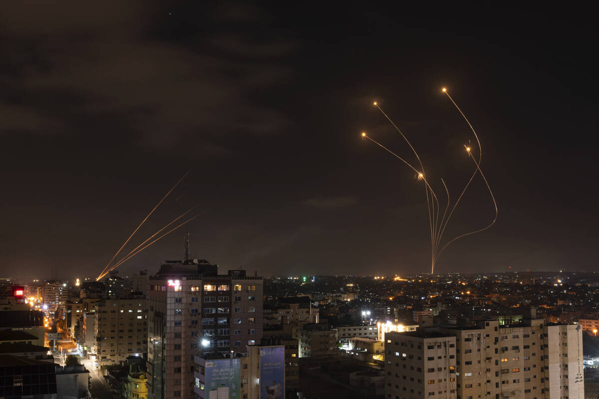 Rockets fired from Gaza and intercepted by Israel's Iron Dome anti-missile system over Israeli ...