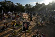 People visit the site of the Nova music festival, where hundreds of revelers were killed and ab ...