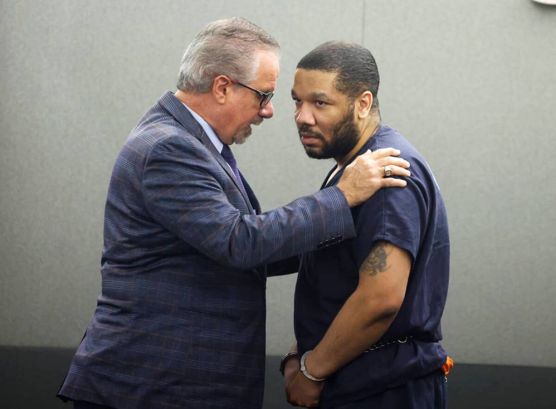 Attorney Ozzie Fumo, left, comforts his client Julius Trotter, who was found guilty of breaking ...