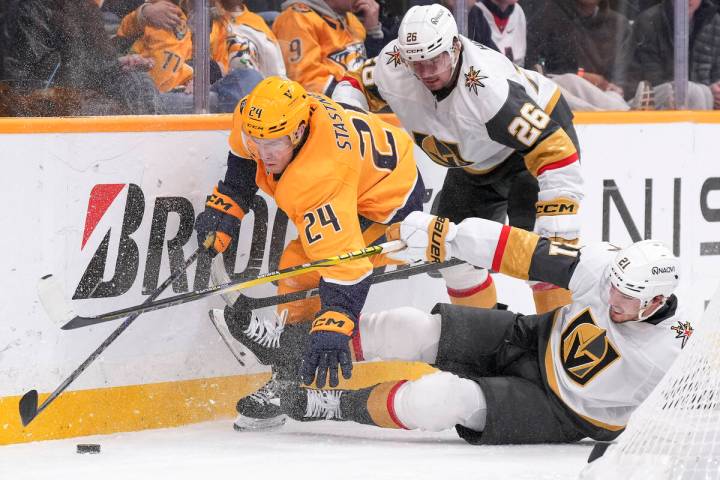 Nashville Predators defenseman Spencer Stastney (24) battles Vegas Golden Knights right wing Al ...